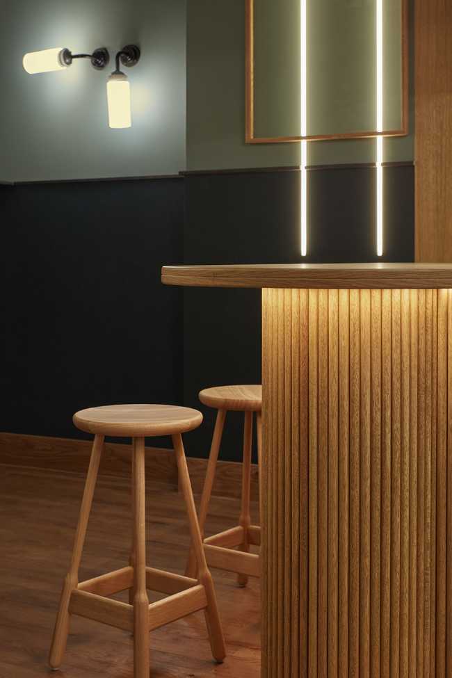cafeteria amsterdam stools and wooden counter cladding