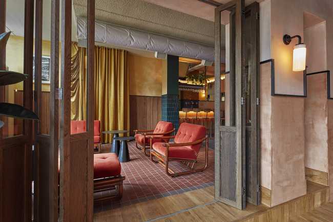 cafeteria amsterdam lounge area armchairs red leather