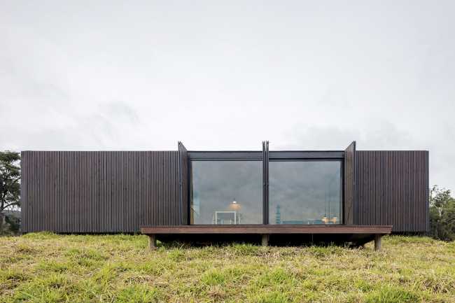 Wooden shelter with elementary shapes