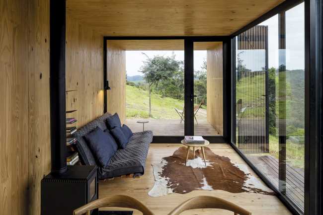 Wooden shelter with elementary shapes