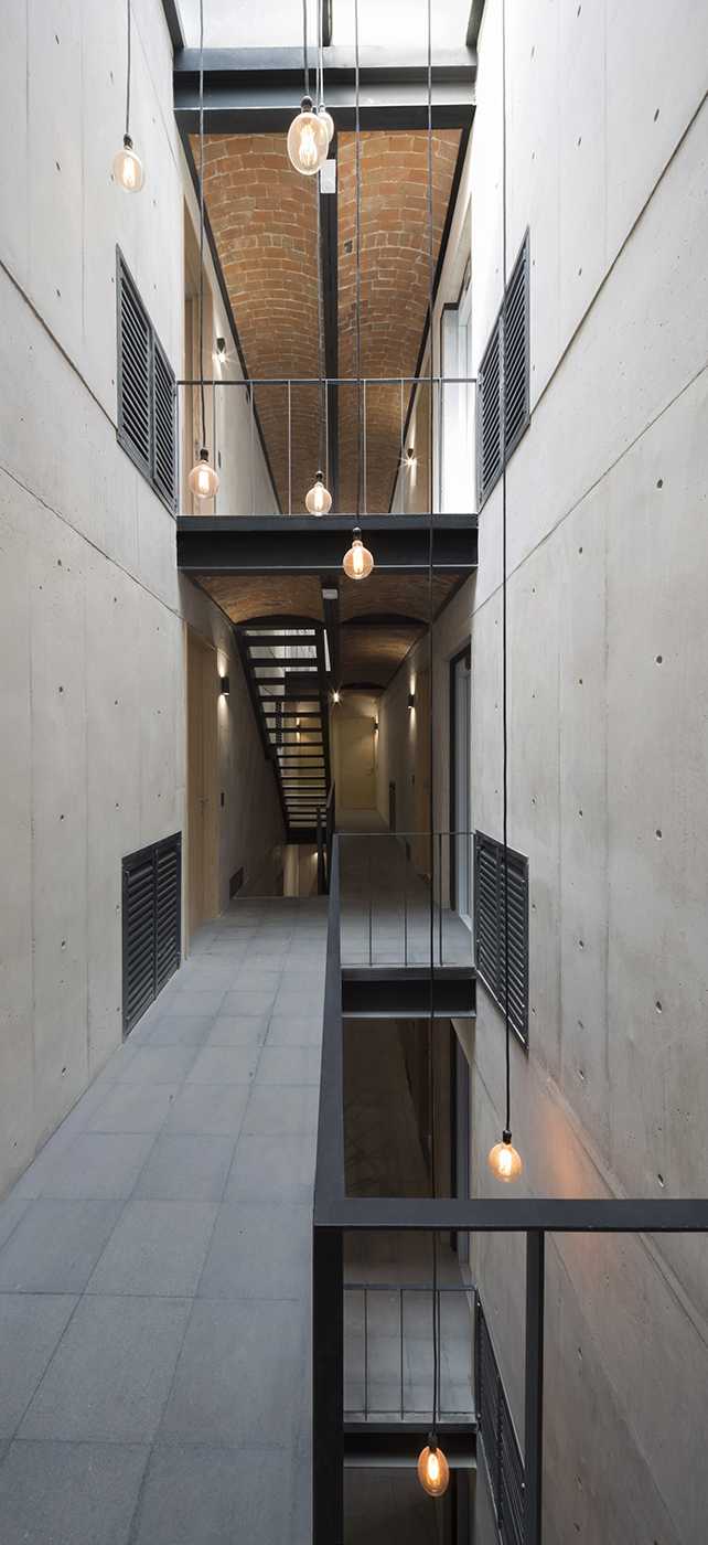 residential complex corridors double volume structure reinforced concrete exposed