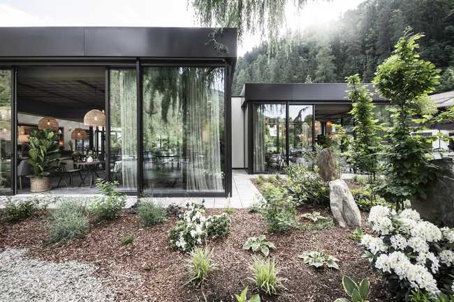 hotel suite glass and metal modules garden