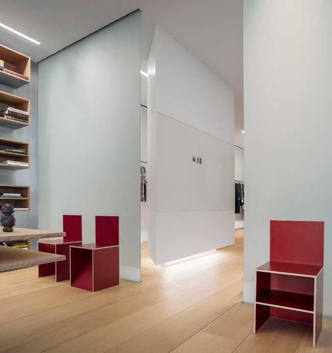 Loft industrial pour une photographe à New York. Plancher en chêne et détails en fonte d'acier