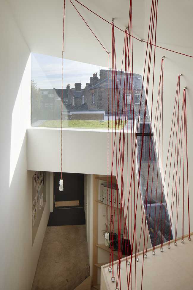 double volume loft staircase wood cables red