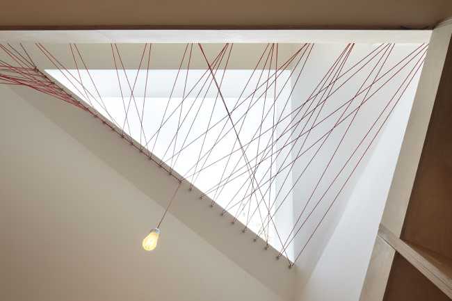 double volume loft staircase wood cables red