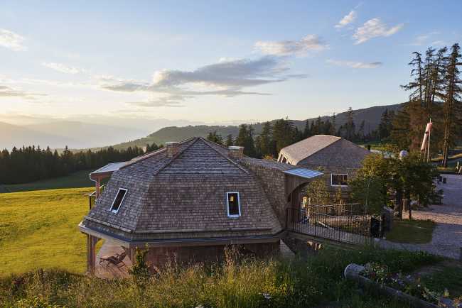 hotel extension structure wood curved roof