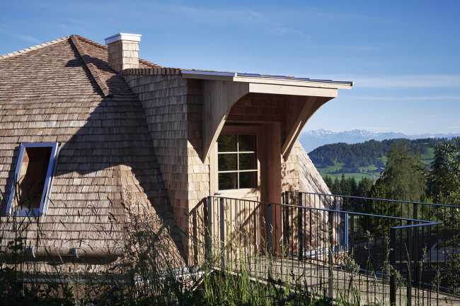 hotel extension structure wood curved roof
