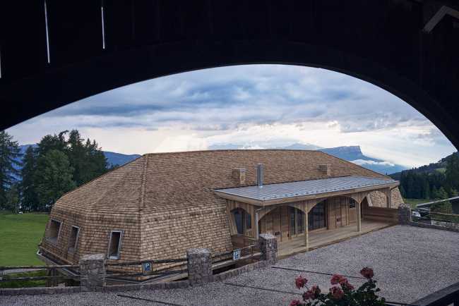 hotel extension apartment structure wood curved roof