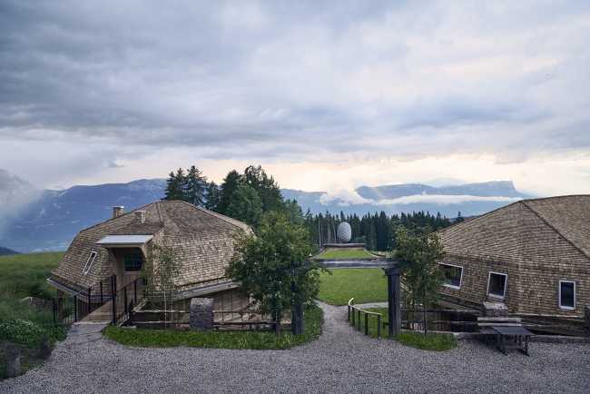 hotel extension apartment structure wood curved roof
