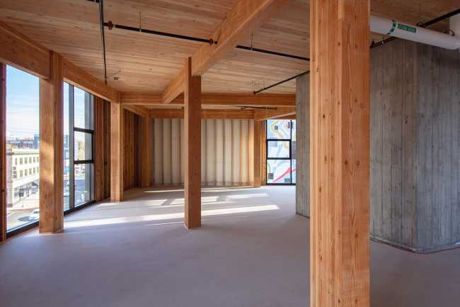 edificio struttura clt rivestimento laterizio mattoni vetrata