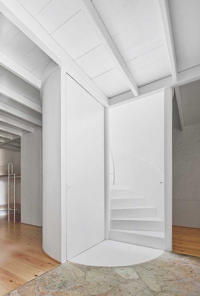 house interior with central spiral staircase