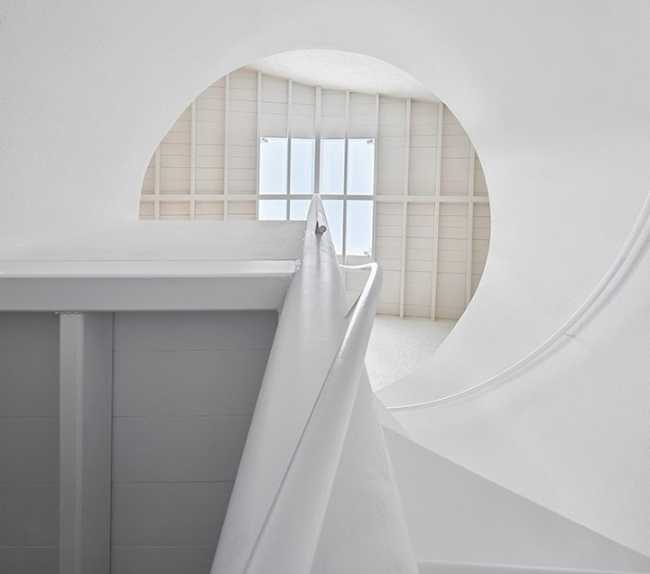 house interior with central spiral staircase