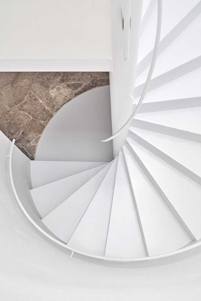 house interior with central spiral staircase