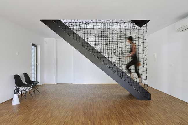 Interior wooden house with sculptural staircase