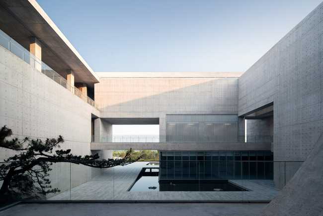 cultural center structure cement courtyard lake