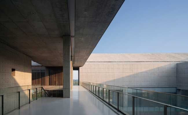 cultural center structure cement parapet glass lake