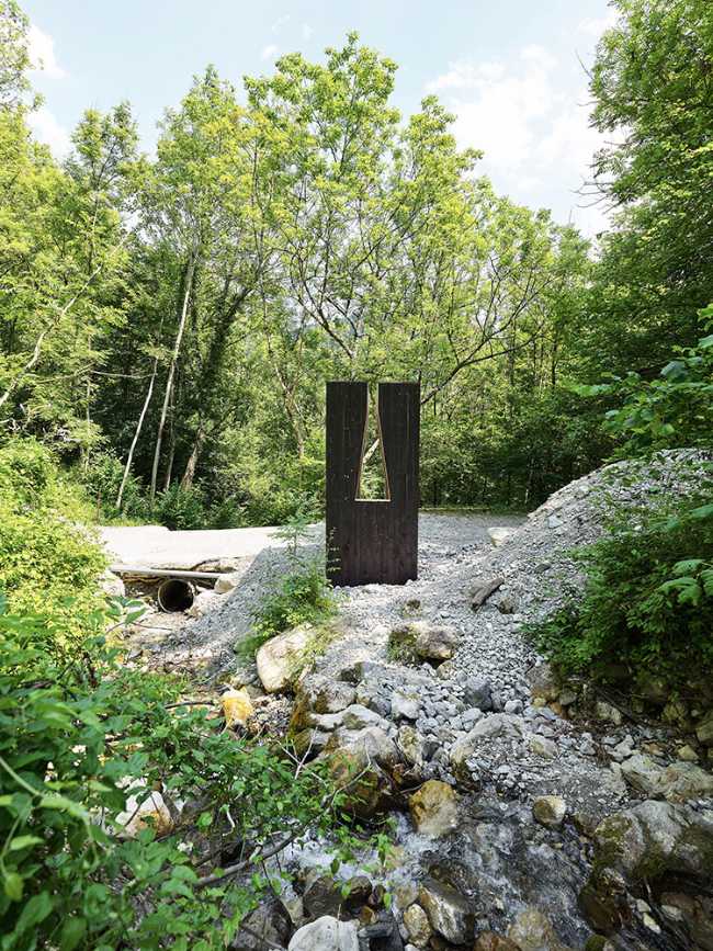 Meditative chapel in the wood in charred wood