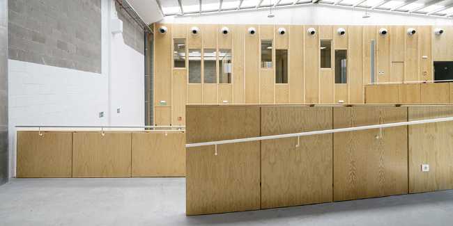 Multifunctional center with wood-clad interior