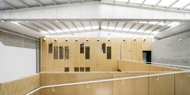Multifunctional center with wood-clad interior