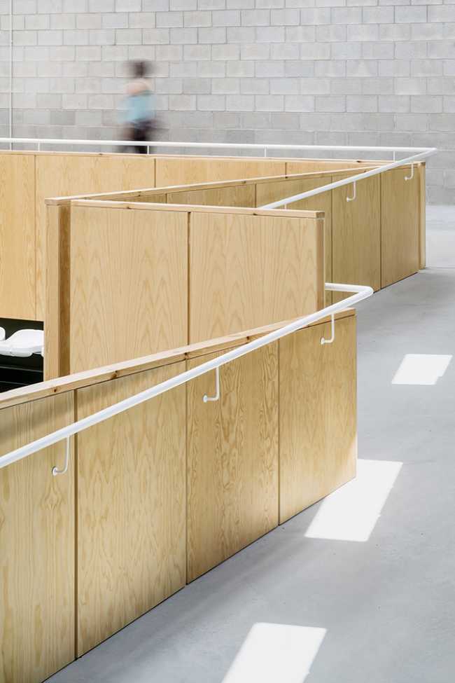 Multifunctional center with wood-clad interior