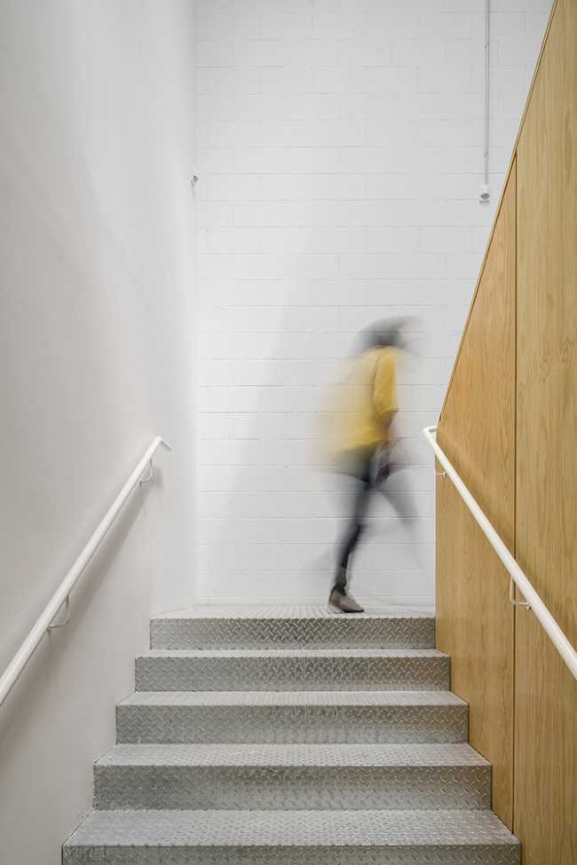 Concrete stair body and wooden balustrade