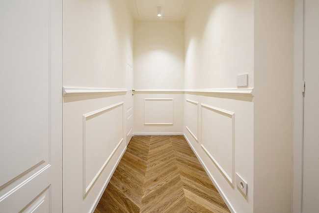 Interior apartment white walls and wooden parquet