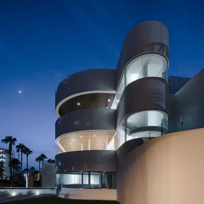 resort towers curved glass terrace wood cladding