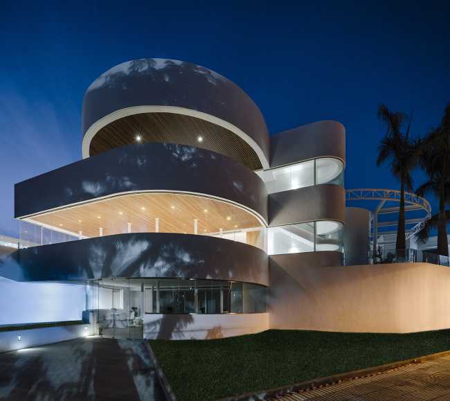 resort towers curved glass terrace wood cladding