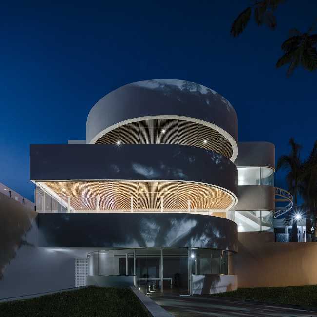 resort towers curved glass terrace wood cladding