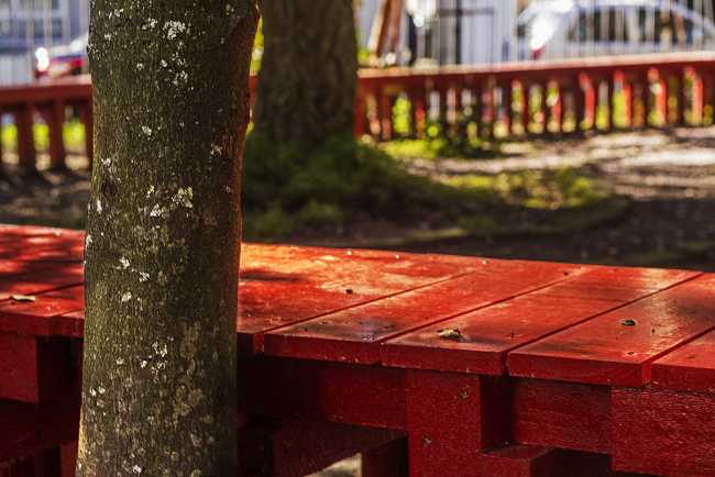 Detail of red wooden bench