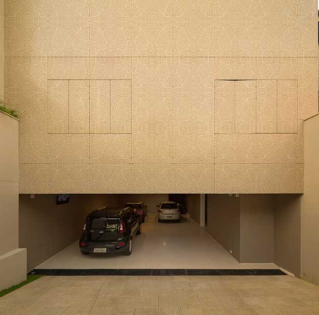 Garage and metal panel cladding