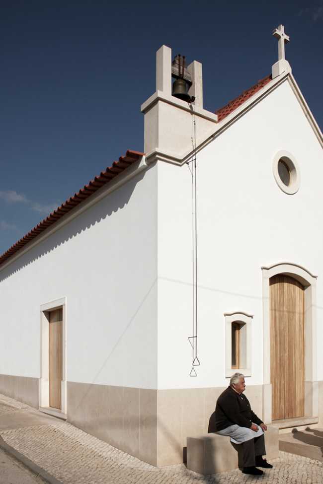 Chapel with white walls and wooden doors