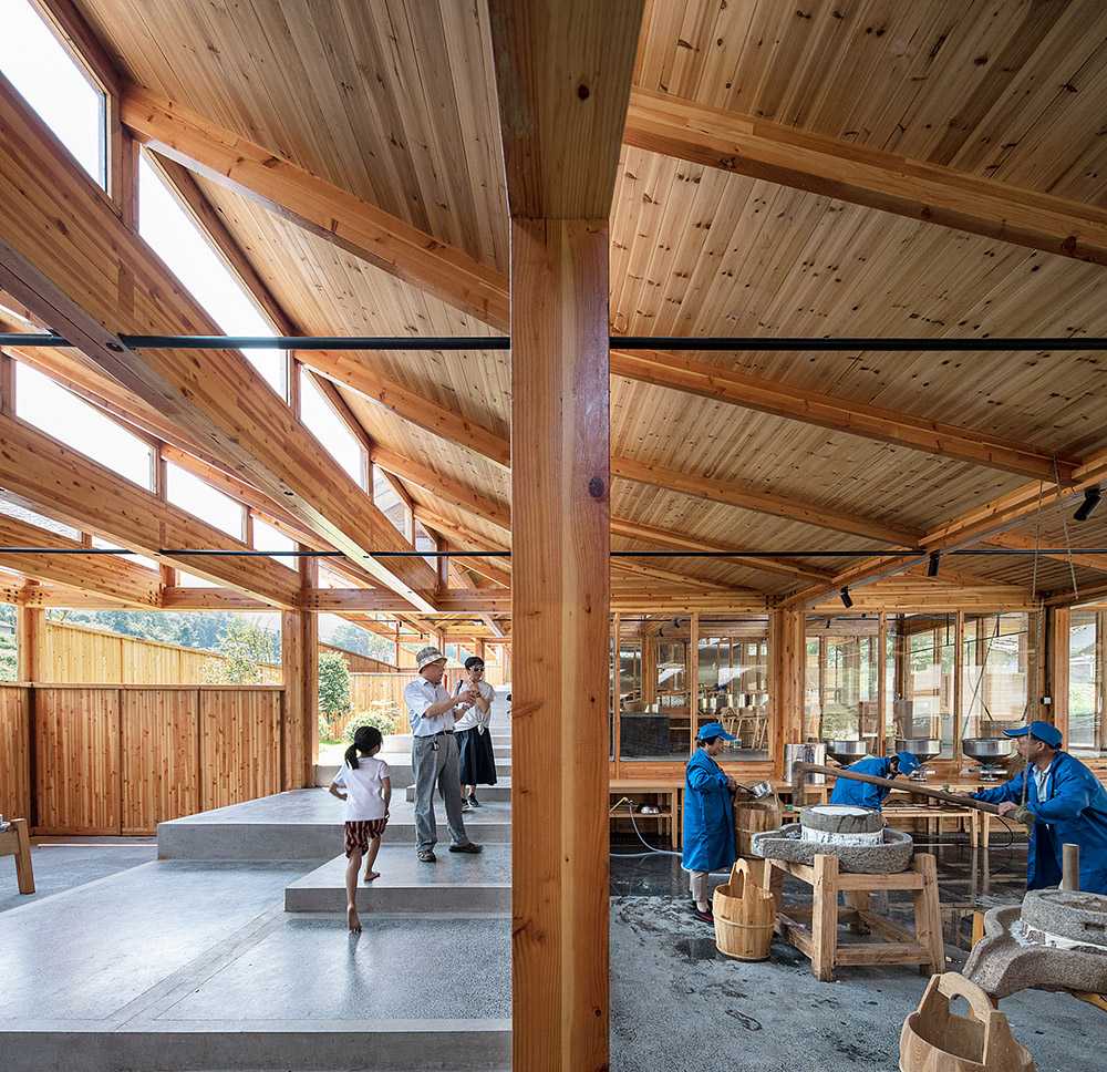Tofu factory in a mountain village. The wooden volume rests on a long slope