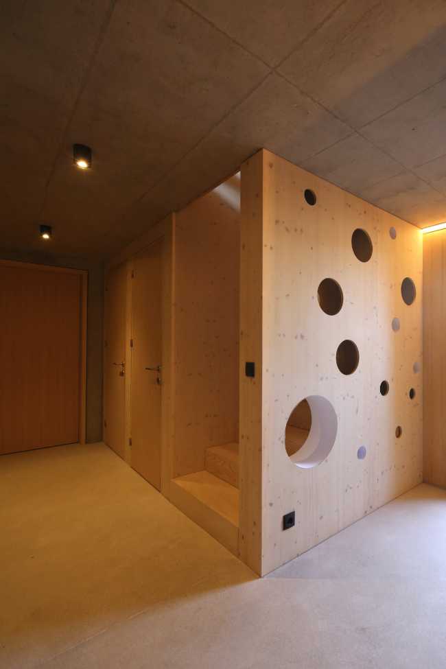Wooden interior with perforated wall