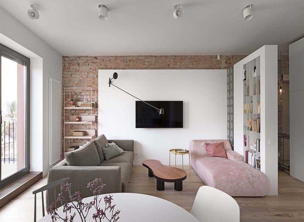 Pink and grey sofa with television