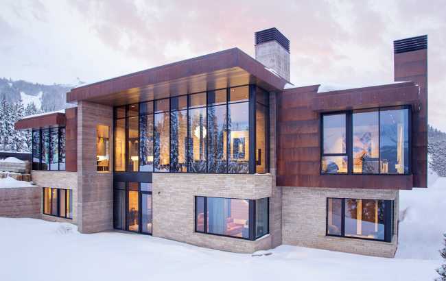 Villa with concrete structure and corten coating snow winter