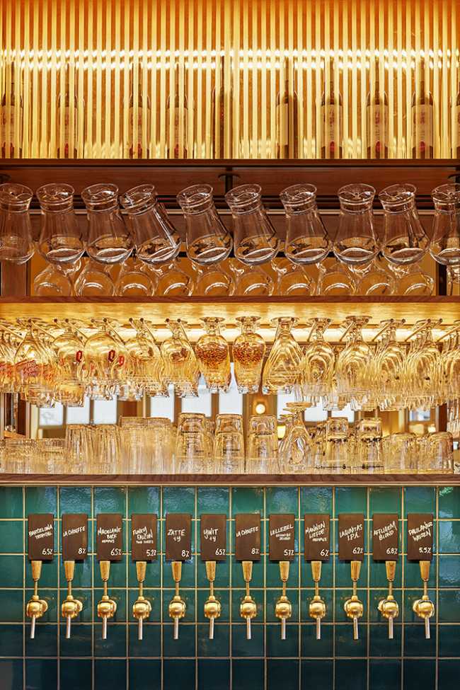 Glasses hanging on the wall of a bar