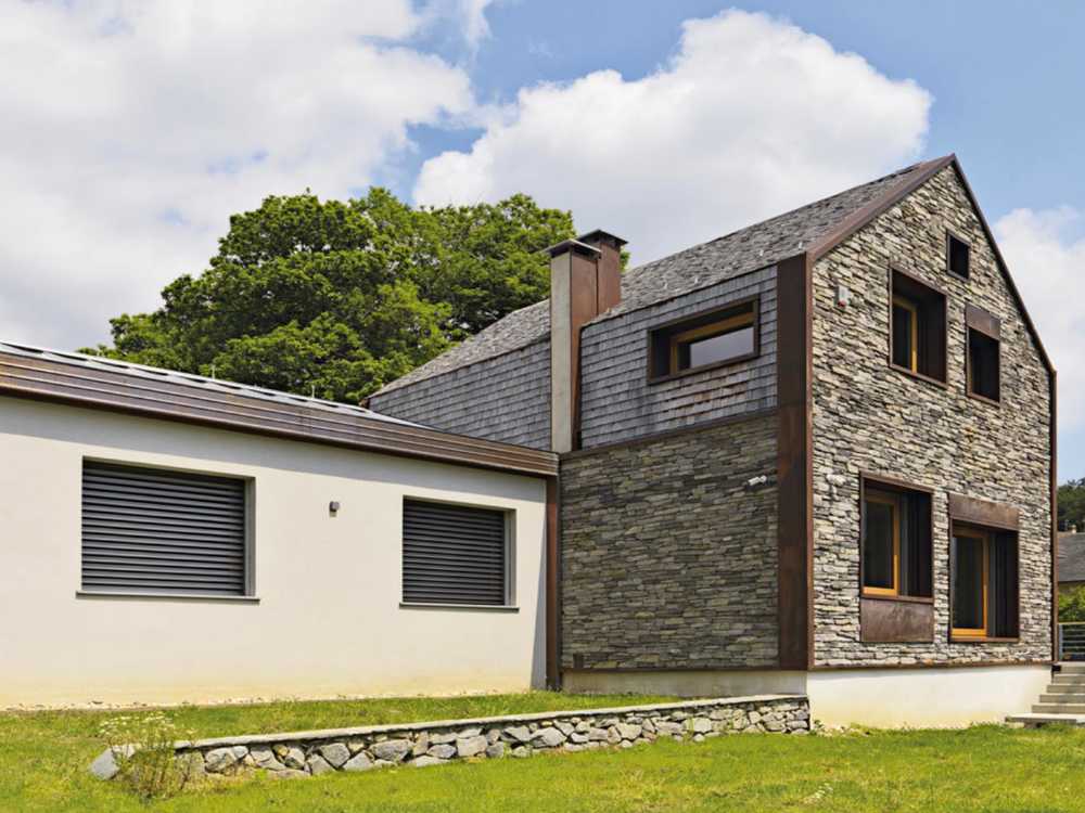 Villa archetipa in legno, acciaio e pietra