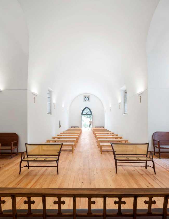 White chapel interior with parquet