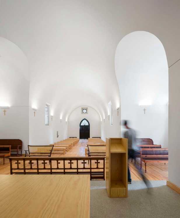 White chapel interior with parquet