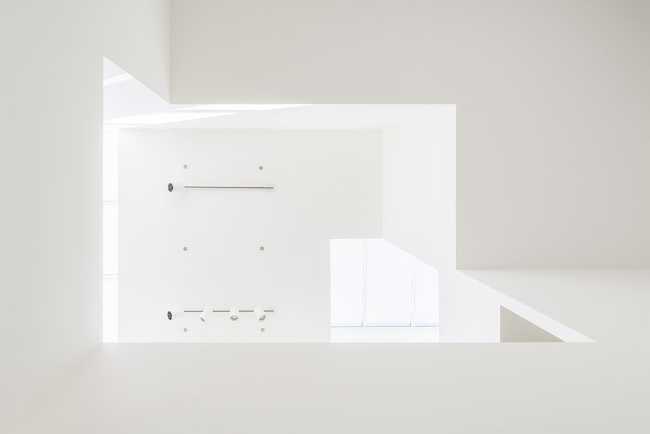 Interior renovation in Brooklyn. Triple-height space at the center of living spaces