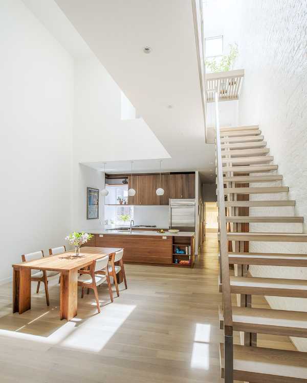 Interior renovation in Brooklyn. Triple-height space at the center of living spaces