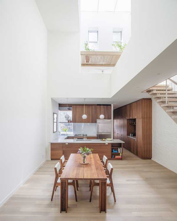 Interior renovation in Brooklyn. Triple-height space at the center of living spaces