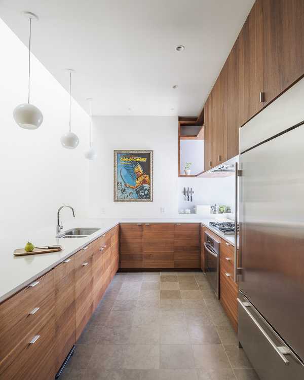 Interior renovation in Brooklyn. Triple-height space at the center of living spaces