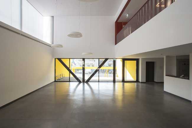 Reconstruction for an elementary school. Polycarbonate facade and colorful interiors