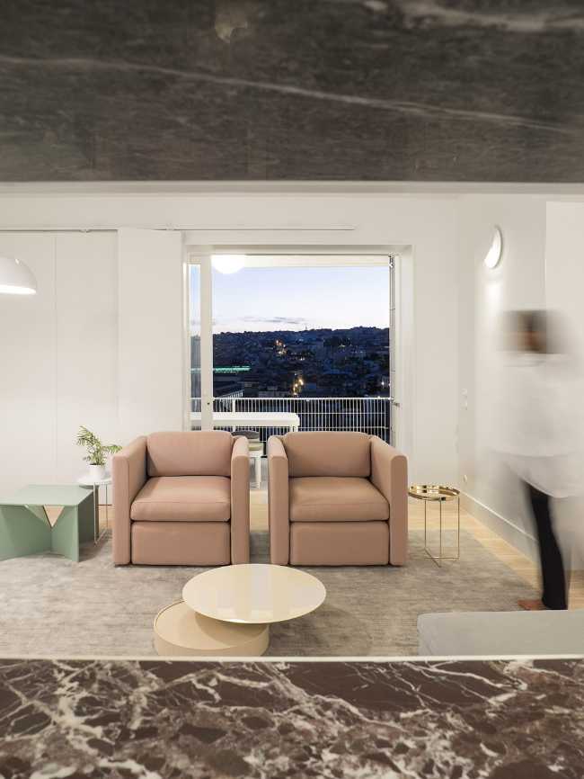 Living room with pink armchairs