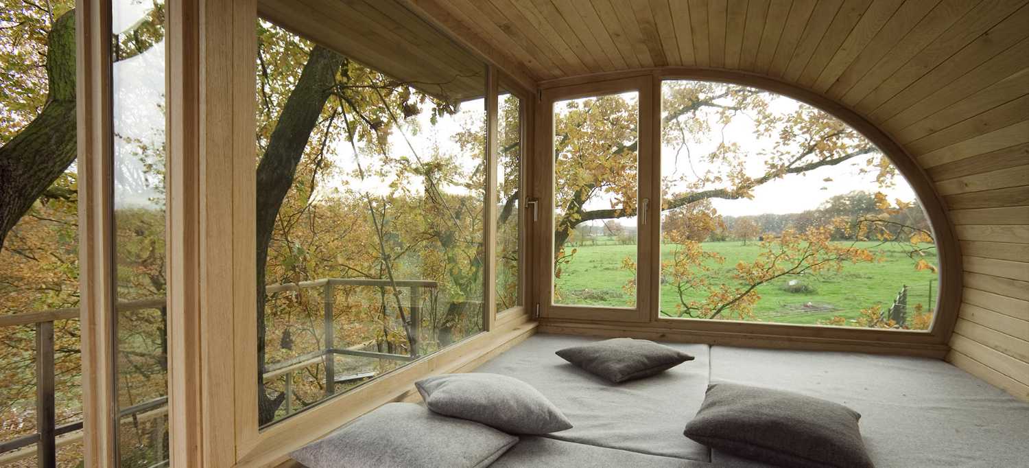 Semicircular house among the trees