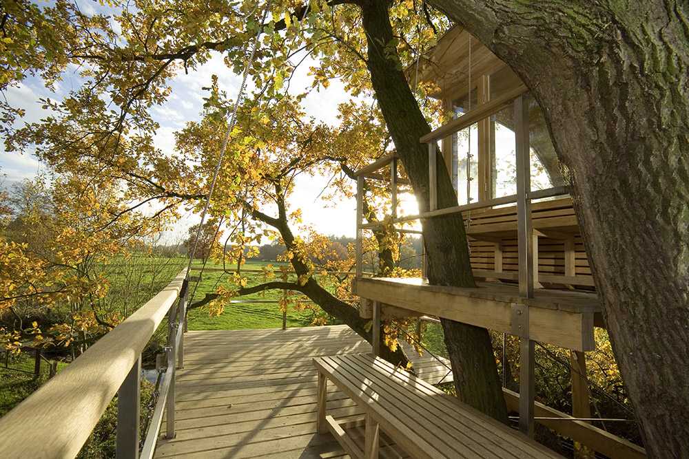 Semicircular house among the trees
