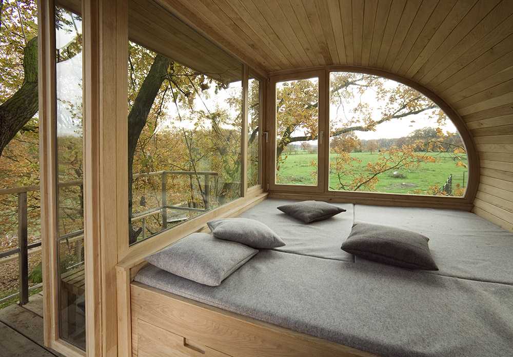 Semicircular house among the trees