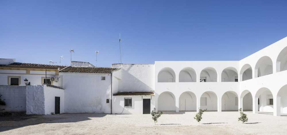 Enlarged parish offices. Perfect square courtyard with geometric rigour